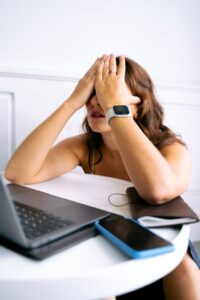 a woman covering her face